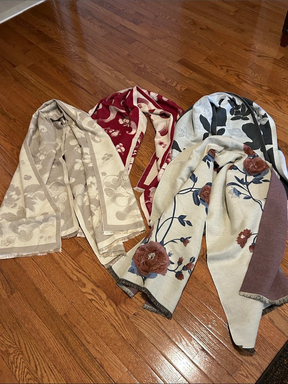 Bundle of 4 floral-printed faux cashmere scarves featuring delicate fringe trim